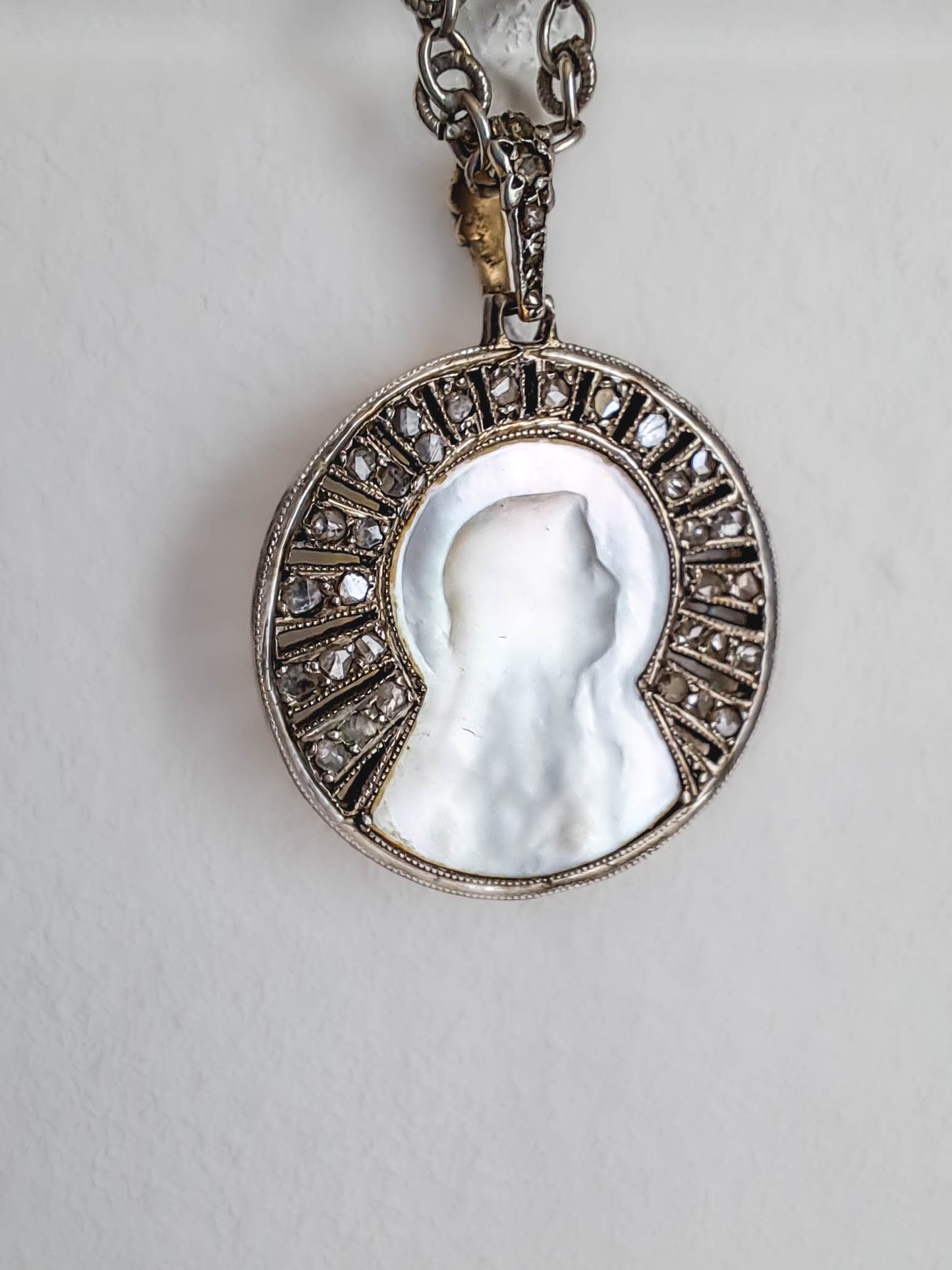 Antique Platinum and 18K Yellow Gold Virgin Mary Pendant with Rose Cut Diamond Halo c. 19000