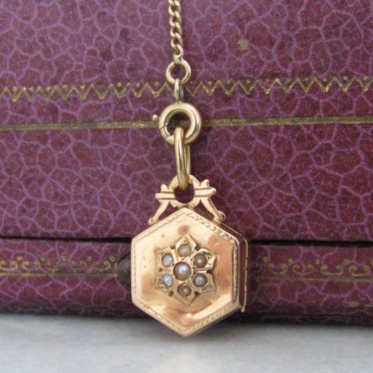 Victorian 18K Gold Hexagon Locket with interior Beveled glass partition and floral center