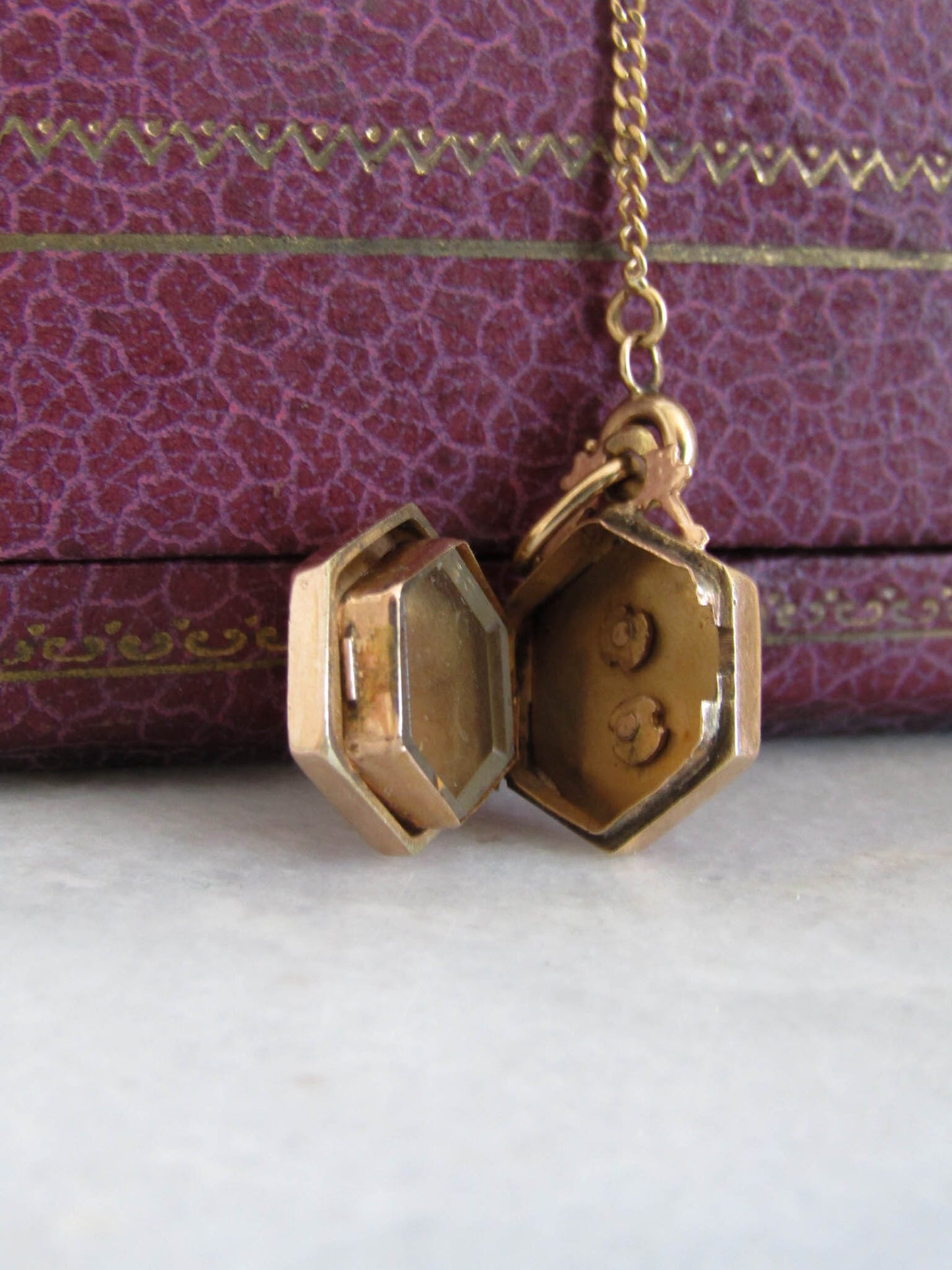 Victorian 18K Gold Hexagon Locket with interior Beveled glass partition and floral center