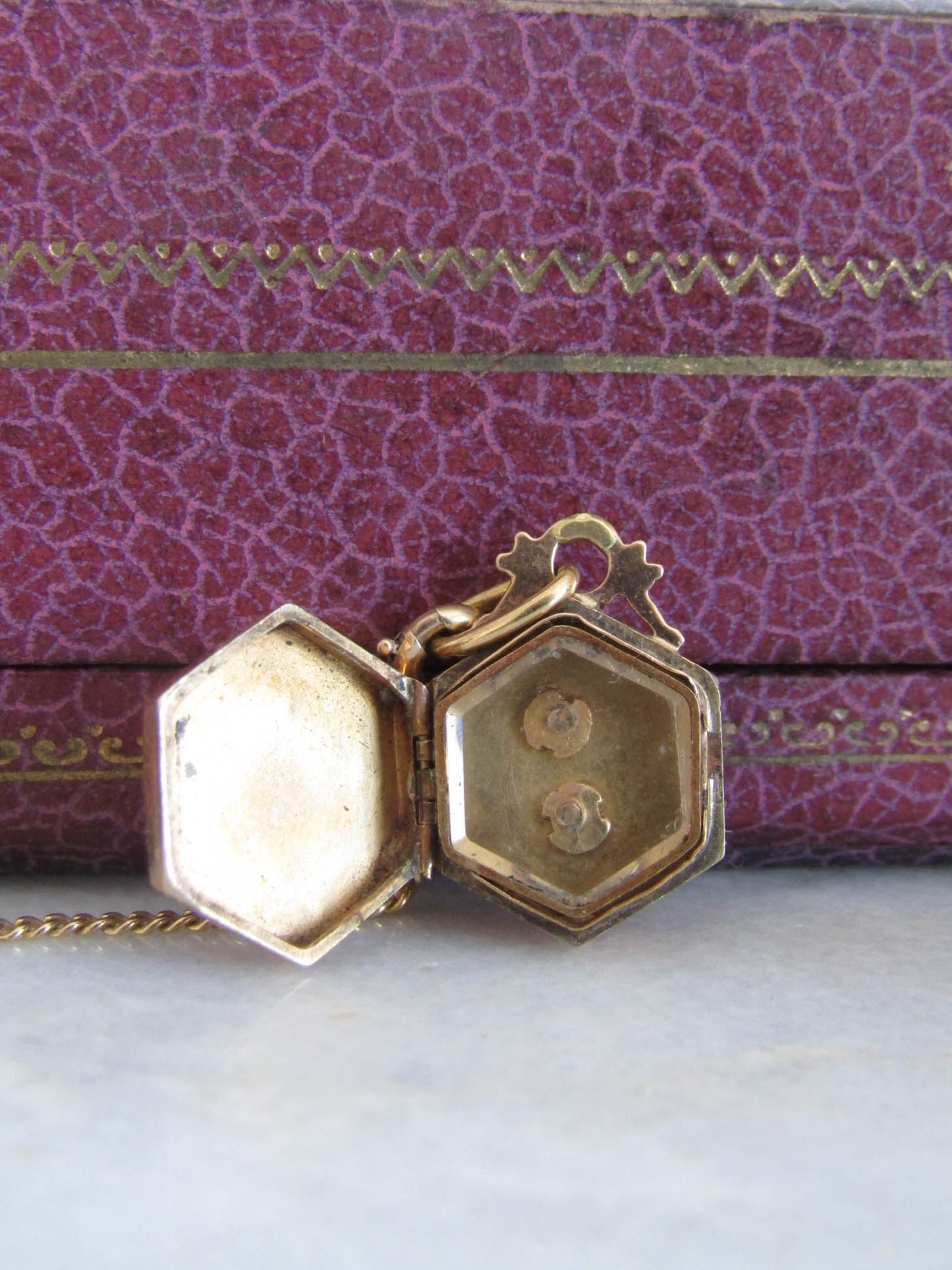 Victorian 18K Gold Hexagon Locket with interior Beveled glass partition and floral center