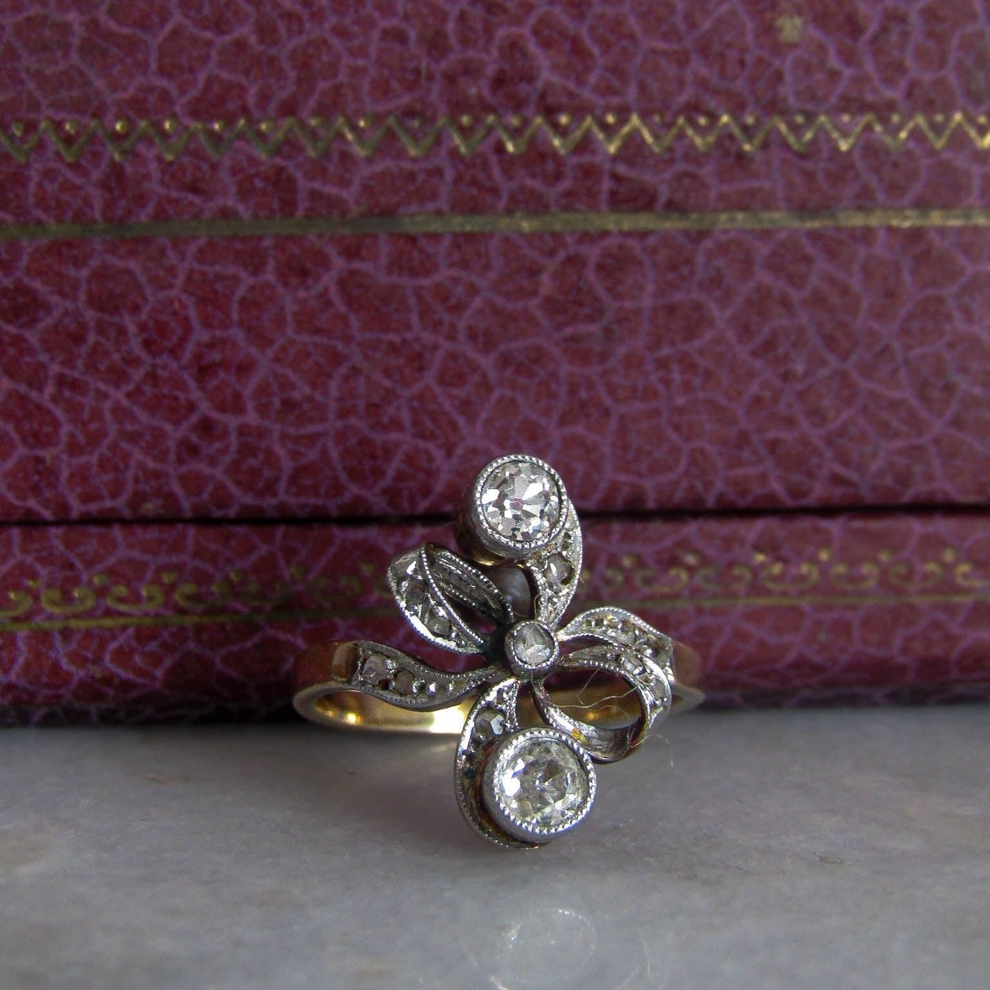 Antique Belle Epoque Old European Cut Diamond Toi et Moi Diamond Bow Ring with Platinum and 18K Gold c. 1900