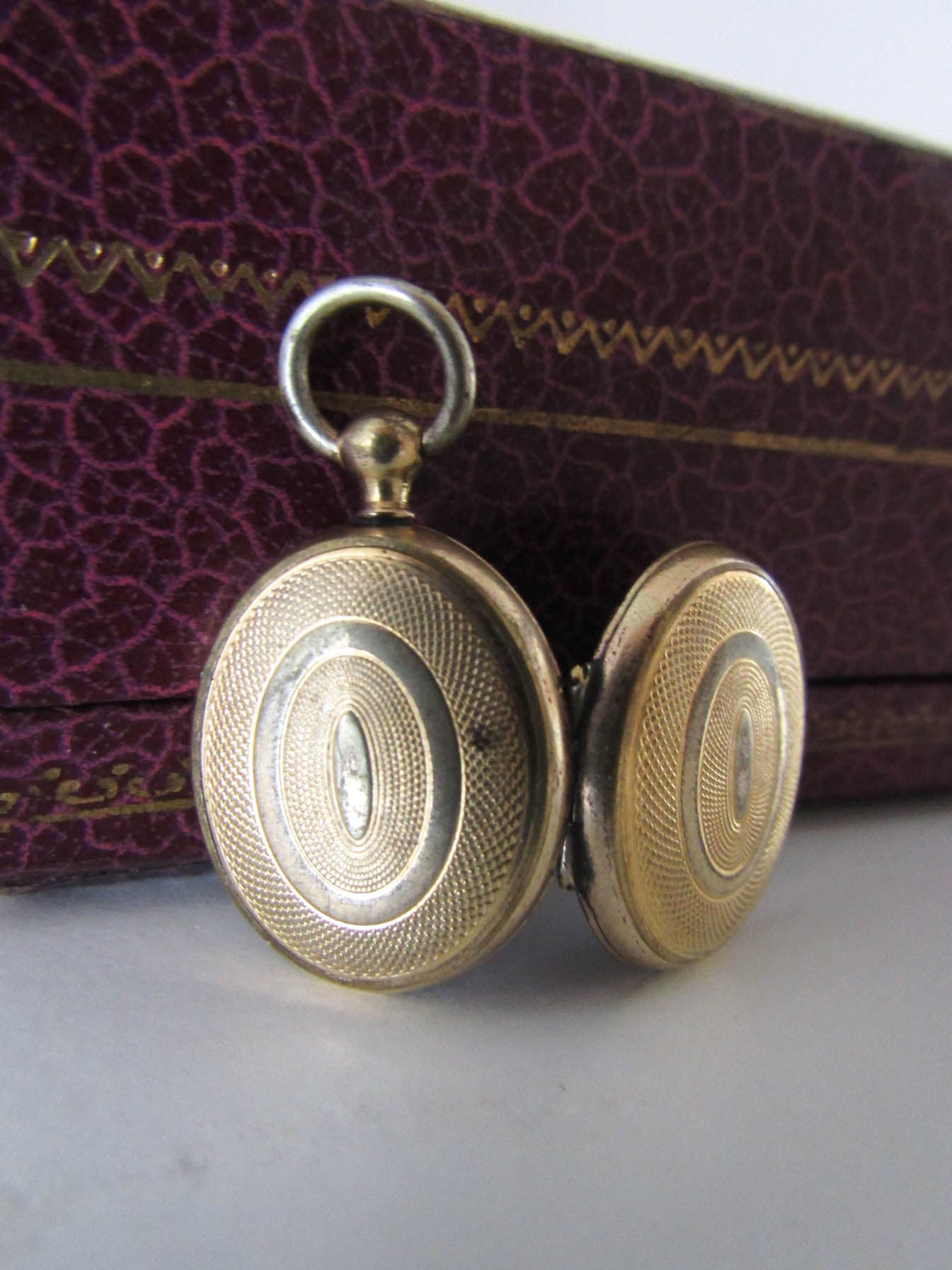 Antique Guilloche Gold Gilt Locket with interior glass frames, Small French Photo Locket